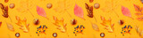 Beautiful autumn leaves, acorns, nuts and berries on orange background. Banner for design