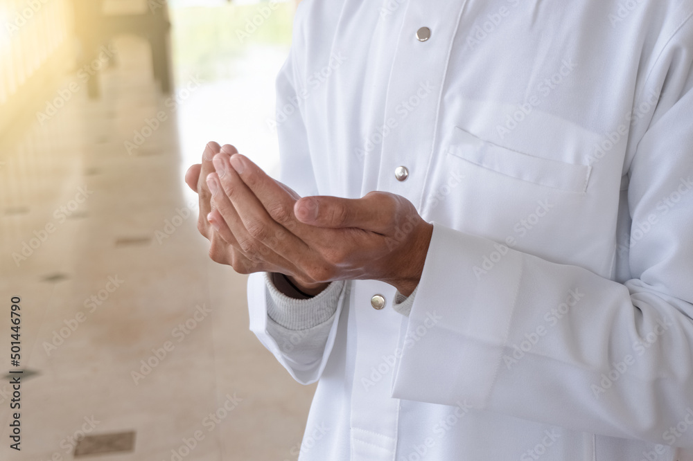 Muslim prayer worship and pray for Allah's blessings in Islamic mosque. Muslims pray to Allah during the holy month of Ramadan