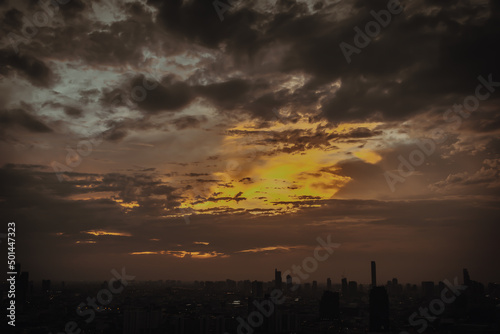 Gorgeous scenic of the sunrise or sunset with cloud on the orange sky over large metropolitan city in Bangkok. Copy space  No focus  specifically.