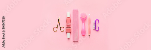 Set of manicure supplies on pink background, top view