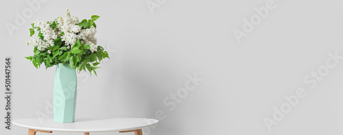 Vase with bouquet of beauti...