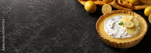 Delicious lemon tart on dark background with space for text