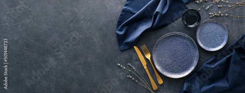 Beautiful table setting on dark background with space for text