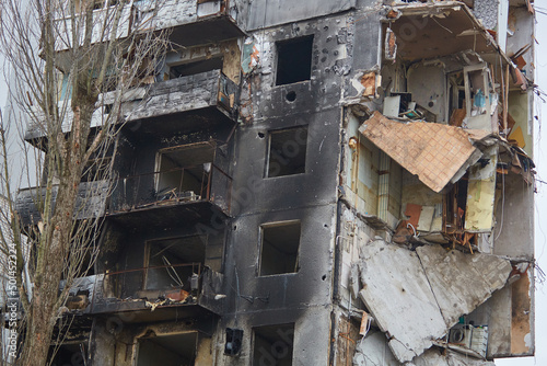 War of Russia against Ukraine. A residential building damaged by an enemy aircraft in the Ukrainian. Consequences of the war  damaged grocery market by the troops of the Russian army.