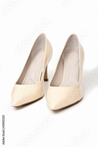 pumps high heel shoes, beige varnished leather footwear, elegant classic shoes on white background