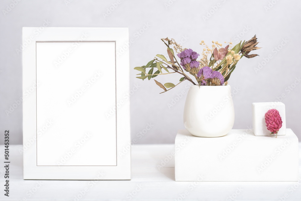white frame with copy space and dry flowers ina vase on geometric podium or pedestal. template for text or inscription. mock up for sale advertisment or inspirational card white frame with copy space and dry flowers ina vase on geometric podium or pedestal. template for text or inscription. mock up for sale advertisment or inspirational card