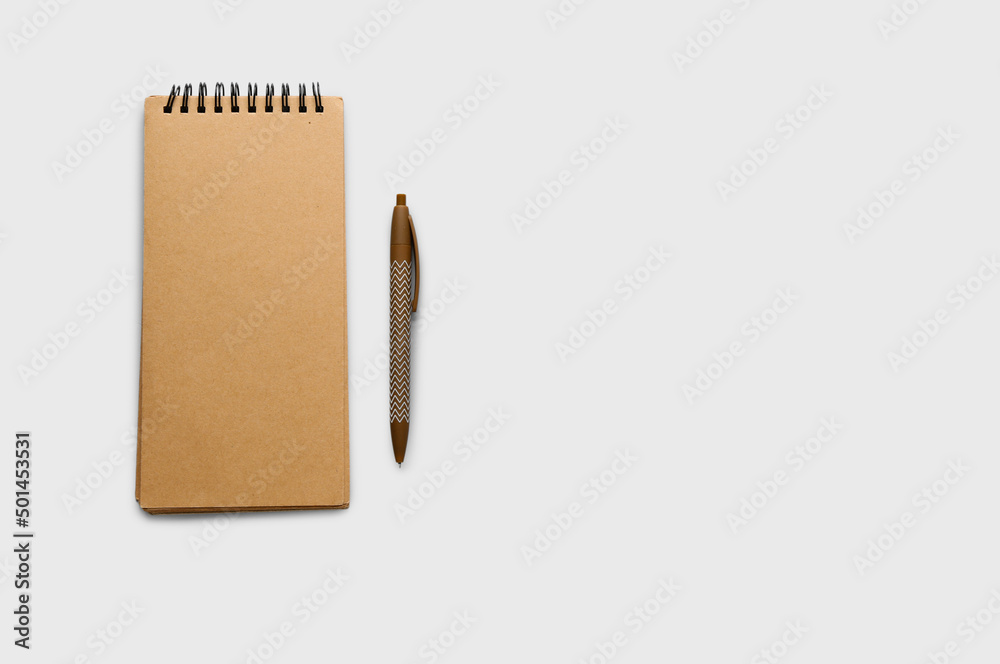 Notebook and pen on light background Notebook and pen on light background