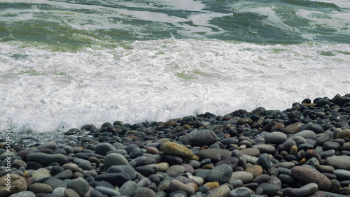 Waves flowing into pebble beach Barranco lima peru
