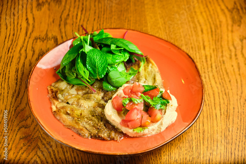 Pasta tartare with basil leaves