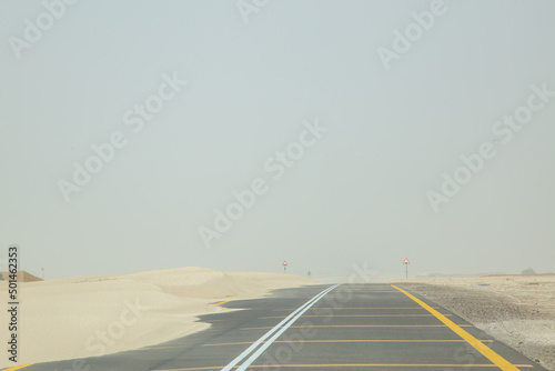 Dessert road in sandstorm hazy out of focus with grain