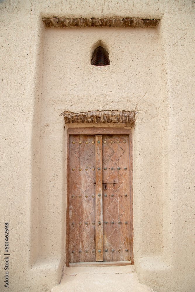 old wooden doors close up in Arabian style out of focus with grain