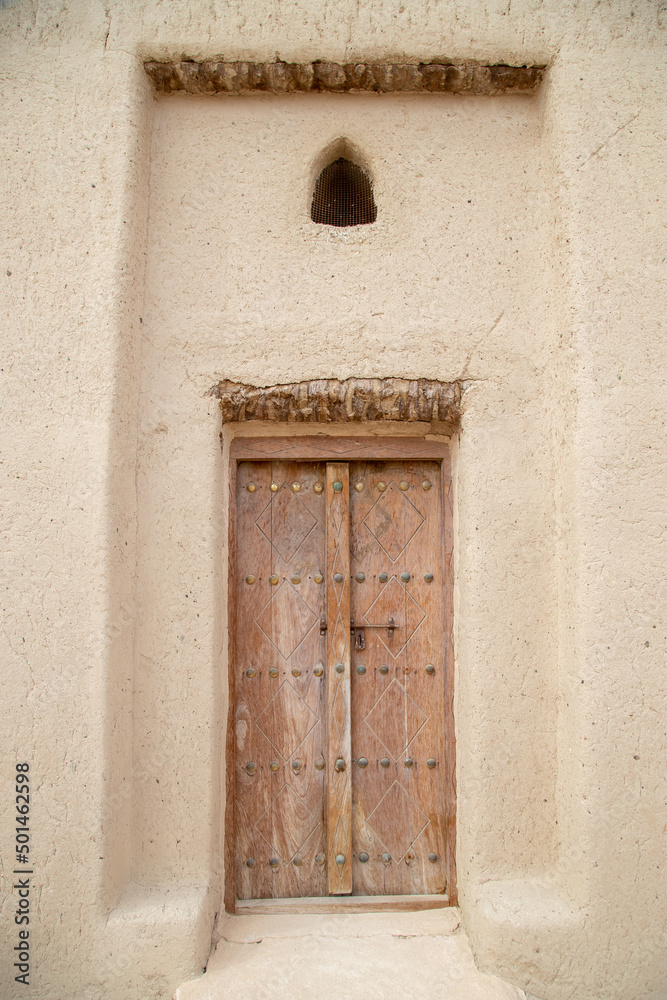 old wooden doors close up in Arabian style out of focus with grain old wooden doors close up in Arabian style out of focus with grain
