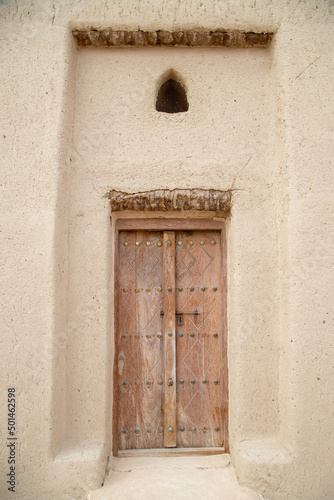 old wooden doors close up in Arabian style out of focus with grain © ca