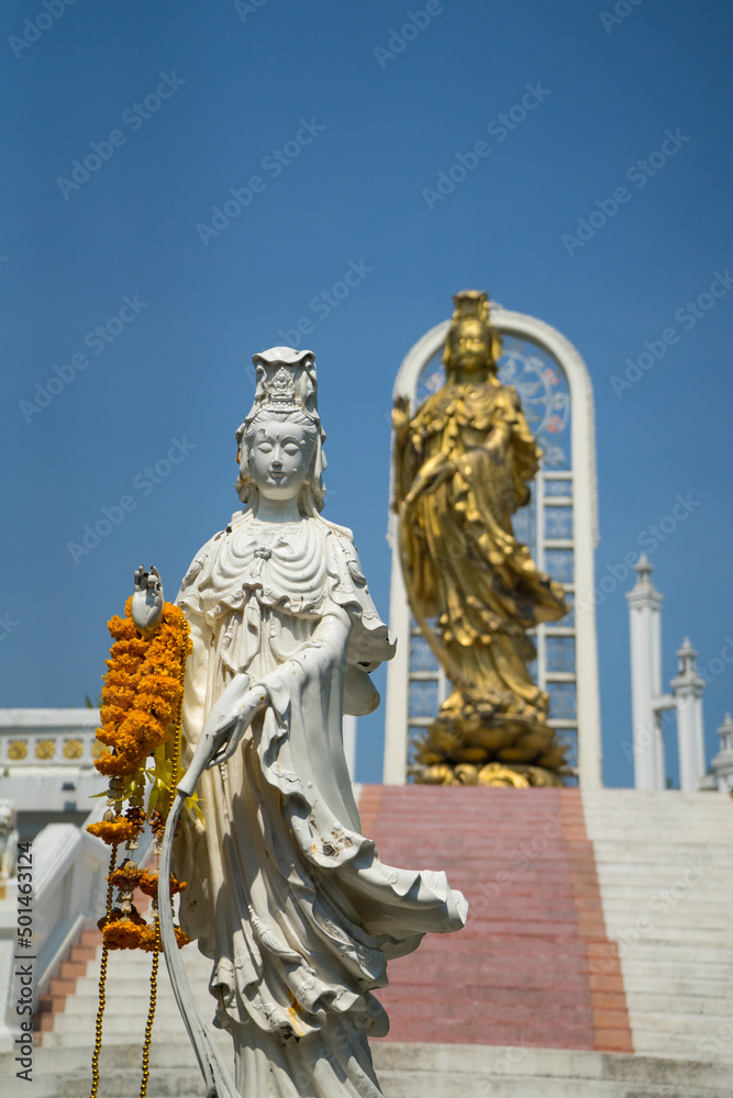 Fototapeta premium statue of white and gold Guanyin (goddess Buddha) is sacred from Chinese people at Wat Srimahapho temple,Nakhon Pathom,Thailand.