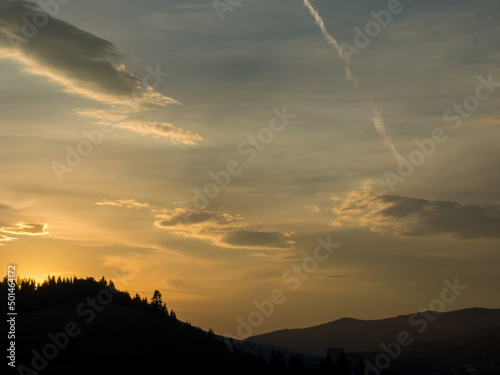 Sunset in Carpathian mountains. Evening in Bukovel, Ukraine. Beautiful natural landscape. Evening light illuminates the valley. Discover the beauty of earth. Silhouette