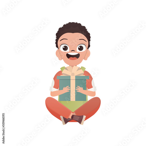 A little boy teenager sits in a lotus position and holds a gift box in his hands. Birthday, New Year or holidays theme. Cartoon style, isolated.
