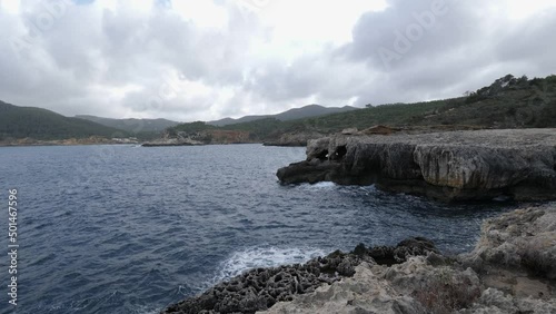 Conserved clean beach shores of Cova de Llevant Labritja Spain photo