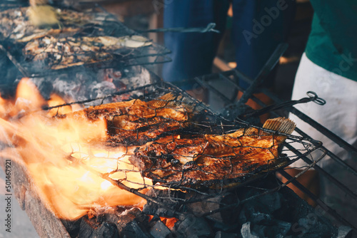 Grilled fish with charcoal for sale at street food market or restaurant in Indonesia