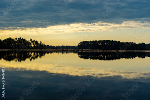 sunset over the lake, the sunset over the water, the clouds at sunset, reflection