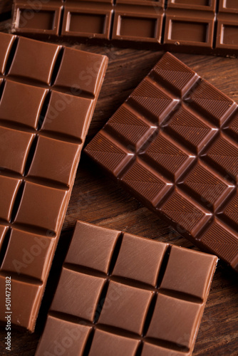 Chocolate bar, candy sweet, dessert food on wooden background