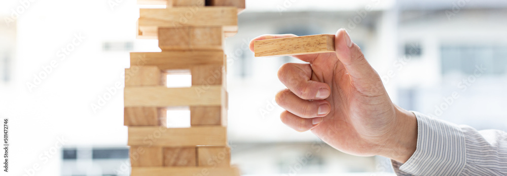 Business people play wooden games, divide the average investment value of a business and jointly manage risks, Alternative risk plan and strategy in business. Business people play wooden games, divide the average investment value of a business and jointly manage risks, Alternative risk plan and strategy in business.