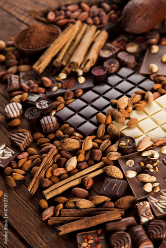 Wallpaper Mural Chocolate bars and pralines on wooden background Torontodigital.ca