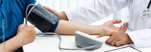Cuadro en lienzo Female doctors use blood pressure monitors and stethoscope to measure pulse Diagnose the patient's disease in a modern hospital medical laboratory, Medical treatment and health care concept