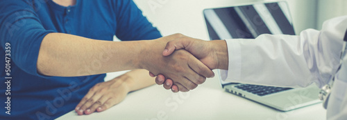 Doctors and patients shook hands after the results of the treatment improved and healed, Congratulation and success concept.