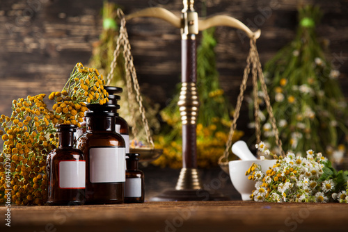 Fototapeta Naklejka Na Ścianę i Meble -  Herbal medicine on wooden desk background