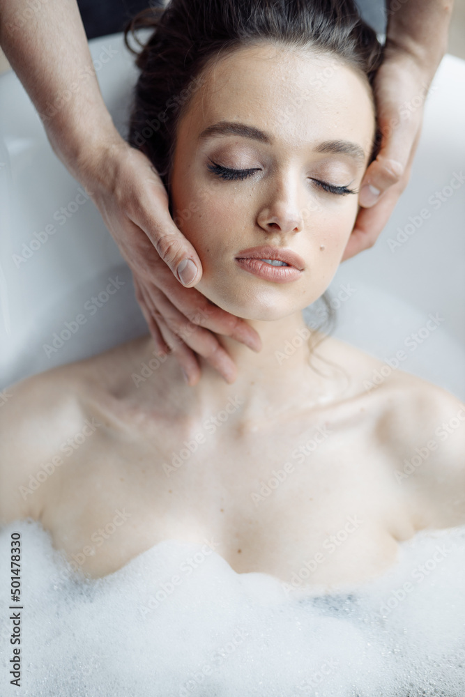 Naklejka premium Facial care and massage, young beautiful and attractive girl on cosmetic procedure
