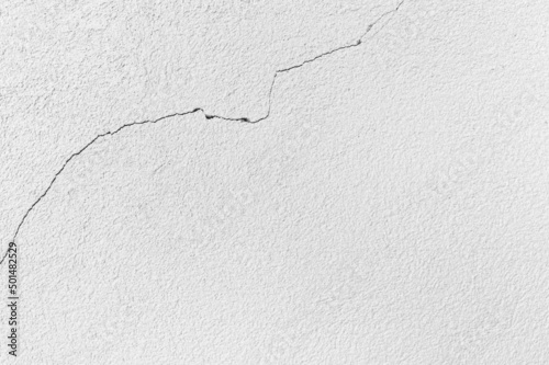 Cracks plaster cement concrete wall. such as house, Building residence subsidence of the ground, caused a slit, silent danger threat that should be addressed, maintained, improved requiring repair.