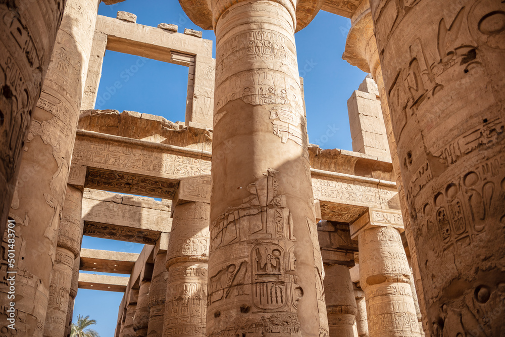 Different columns with hieroglyphs in Karnak temple. Karnak temple is the largest complex in ancient Egypt.