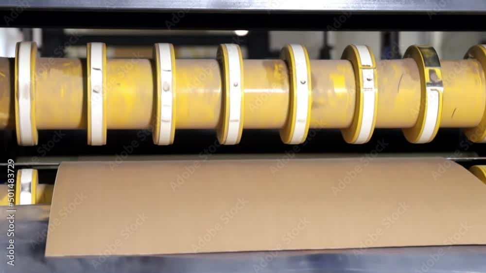 Enterprise. A special machine cuts pieces of paper with sharp knives. Printing industry Enterprise. A special machine cuts pieces of paper with sharp knives. Printing industry