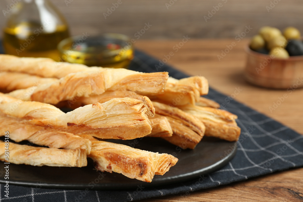 Tasty grissini on wooden table, closeup view Tasty grissini on wooden table, closeup view