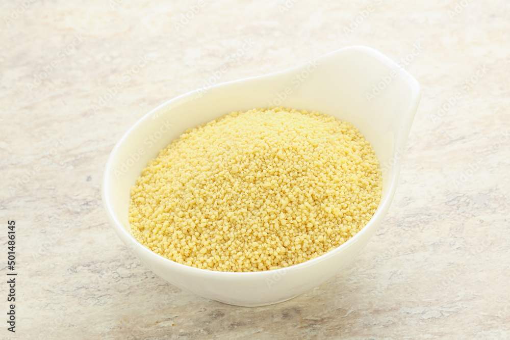 Raw couscous in the bowl Raw couscous in the bowl