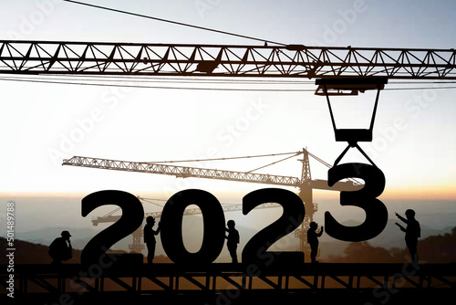 Fototapeta Naklejka Na Ścianę i Meble -  Silhouette staff works as a to prepare to welcome the new year 2023