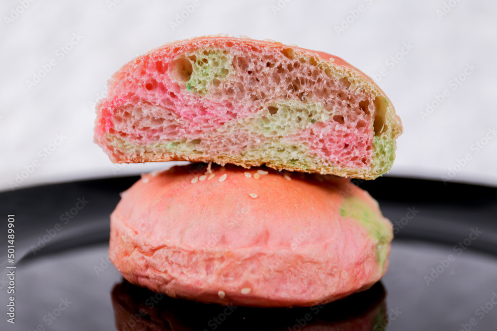Rainbow burger buns with sesame set with copy space for text Rainbow burger buns with sesame set with copy space for text