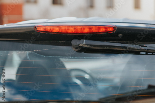 Closeup of a wiper on car rear window photo