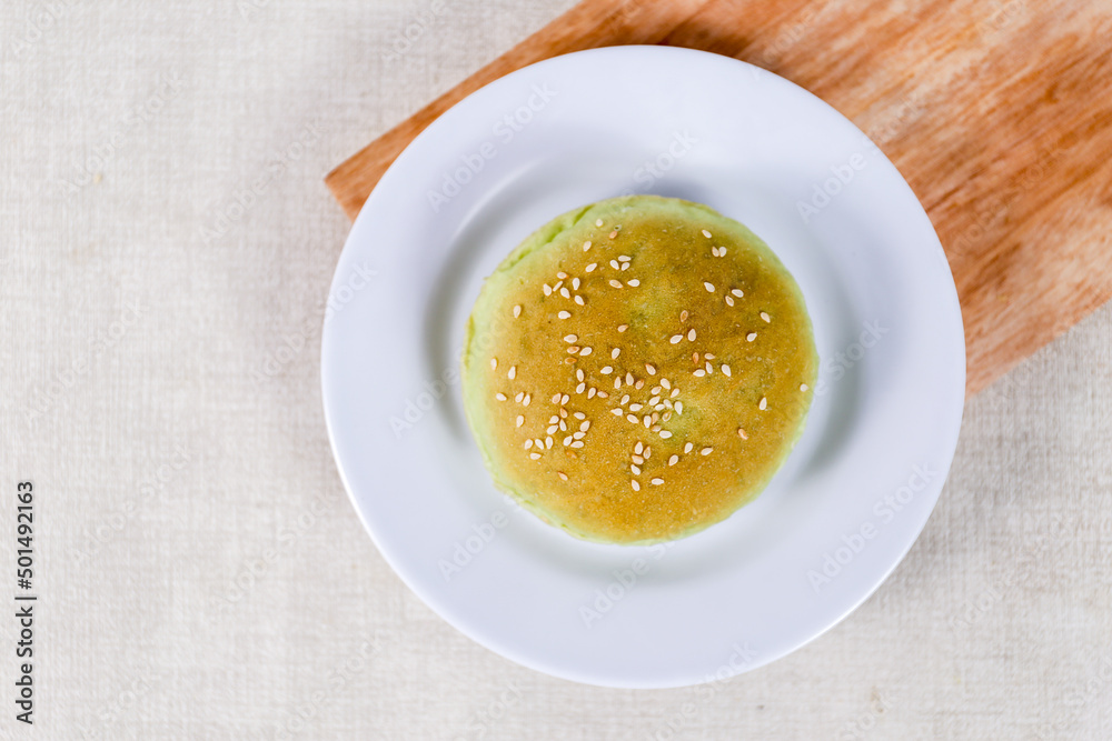 Green Pandan burger buns with sesame set with copy space for text Green Pandan burger buns with sesame set with copy space for text