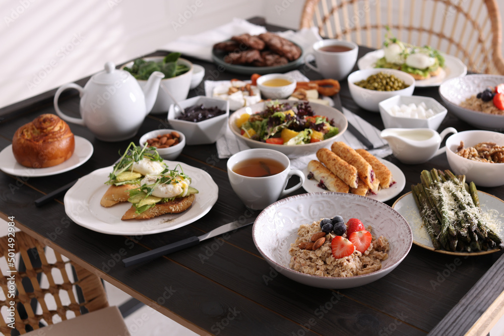 Many different dishes served on buffet table for brunch