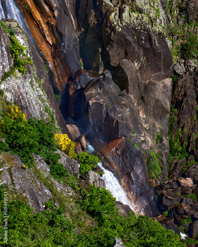 A beautiful view of a green mountain and Frecha da Mizarela waterfall in Arouca Geopark photo
