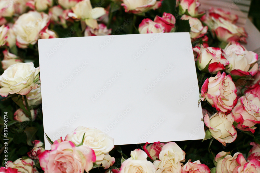 Fototapeta Wedding, birthday stationery mock-up scene. Blank paper greeting card, invitation. Decorative floral composition. Closeup of pink roses petals. Mock up with empty space.