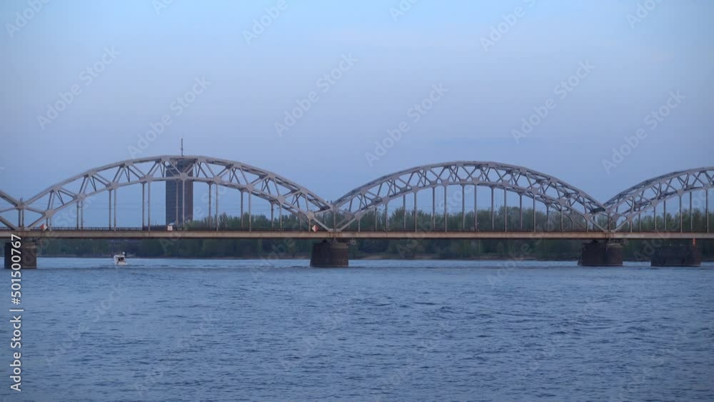 The Railway bridge in Riga. Dusk The Railway bridge in Riga. Dusk