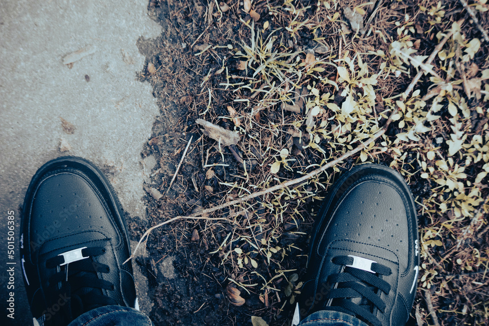 Top down view of shoes - socks of black sneakers