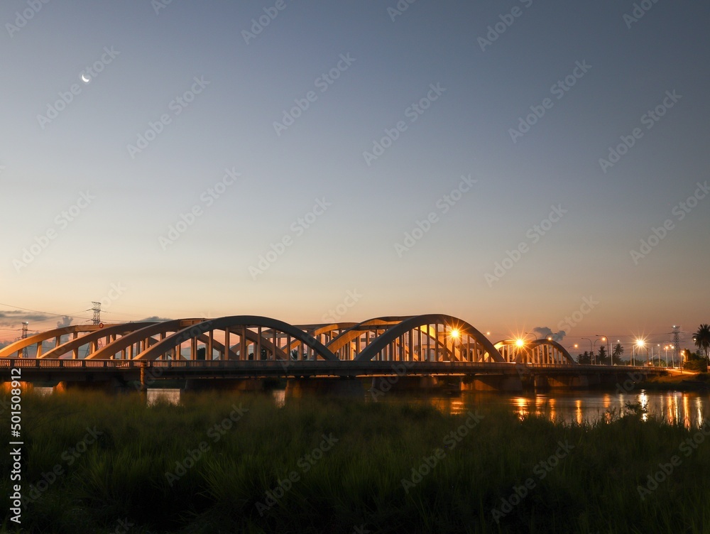 dawn view of a bridge over the river