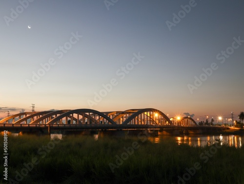 dawn view of a bridge over the river