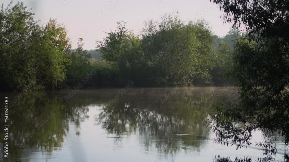 Sunrise on the river. Morning mist at dawn Sunrise on the river. Morning mist at dawn