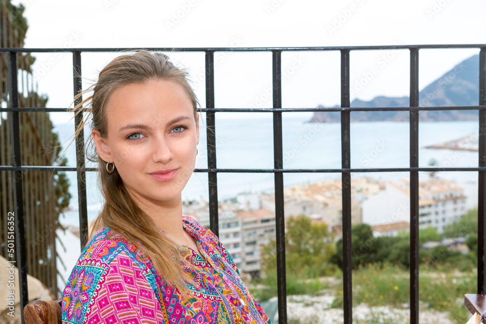 portrait of beautiful blue-eyed blonde with sea view portrait of beautiful blue-eyed blonde with sea view
