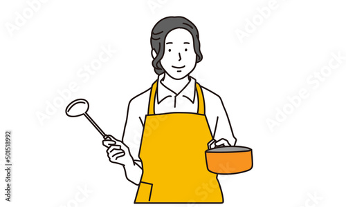 キッチンで料理をするアジア人女性	