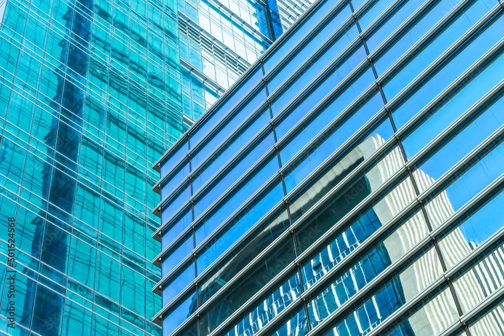 Obraz premium background of the glass modern office building.